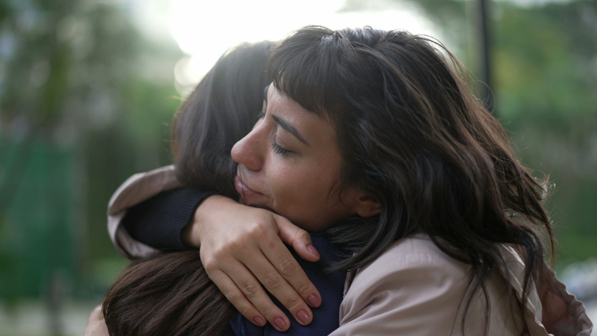 Two women embracing with empathy